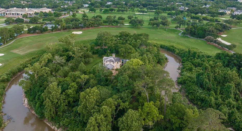 Aerial view of The Lodge in Hunters Creek with Buffalo Bayou and landscape.