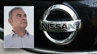 Former Nissan CEO takes auto giant to court