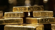 Gold nears record on weaker economic data