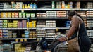 HOUSTON, TEXAS - AUGUST 15: A customer shops for eggs in a Kroger grocery store on August 15, 2022 in Houston, Texas. Egg prices steadily climb in the U.S. as inflation continues impacting grocery stores nationwide. 